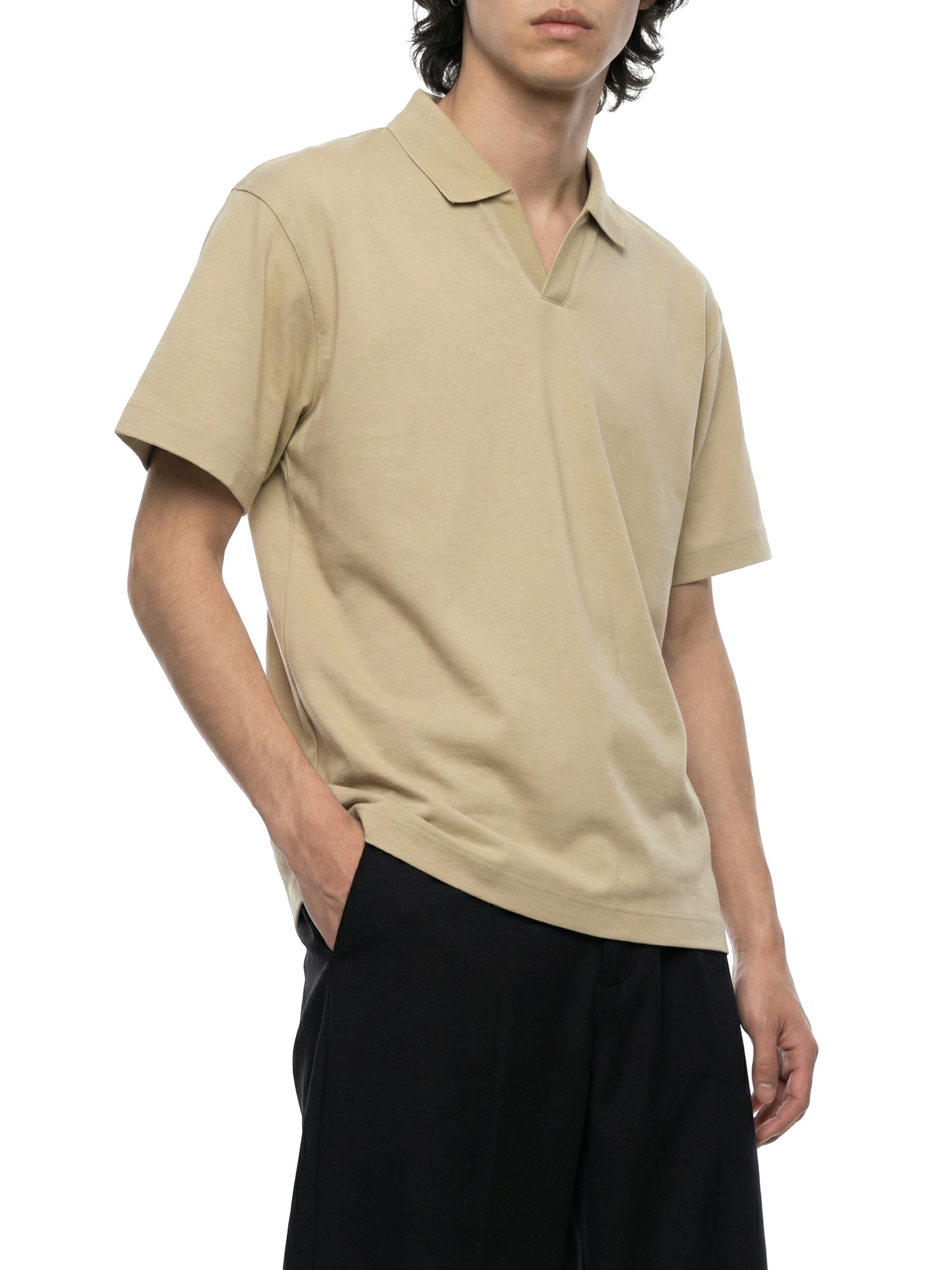 Person wearing a beige polo shirt and black pants on a transparent background